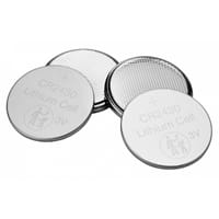 Four silver Verbatim CR2430 lithium coin cell batteries are arranged in a small overlapping cluster on a white background.
